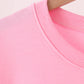 Pink football sequin mom&me top