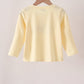 Beige character embroidery top