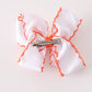 Orange Jack-O-Lantern embroidery crochet edge hair bow
