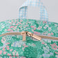Green floral ruffle backpack