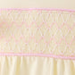 Cream smocked bow bubble