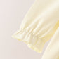 Cream smocked bow dress