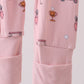 Pink golf cart print bamboo romper