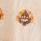 Beige turkey embroidery romper